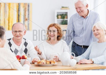 Happy Senior Friends Drinking Tea