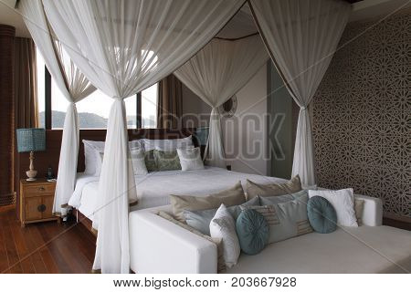 Bedroom with sunlight before sunrise. Decoration of the bedroom in earth tone.