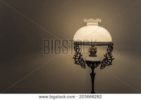 Antiques lamp on the dark background. Vintage style.