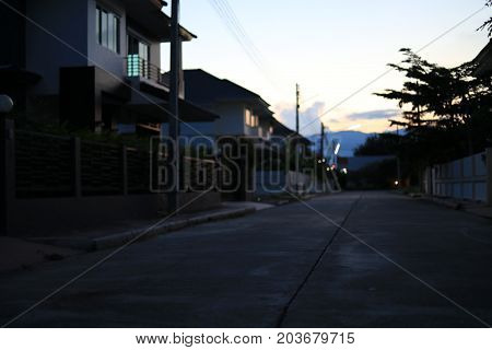 night street in residential house building village suburb image blur background