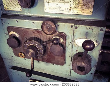 close up photo of old metal lathe.