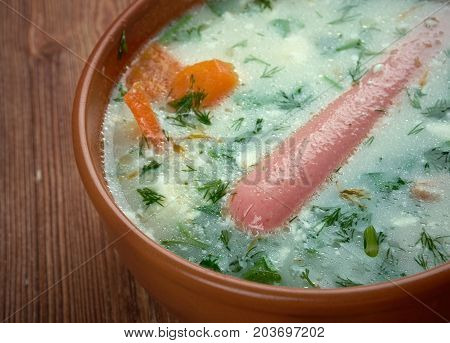 Kartoffel-Cremesuppe. potato soup with Vienna sausage , close up meal