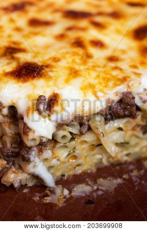 Pastitsio Traditional Greek Baked Pasta Casserole With Ground Beef, Tomatoes, Feta Cheese And Becham