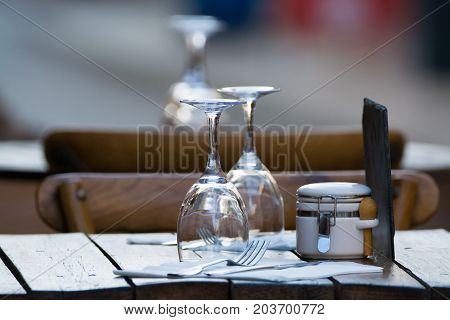 Empty Wine Glasses On The Table Served For Lunch, Dinner In Cafe, Restaurant Outside Or On Terrase