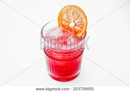 pink cocktail decorated with a slice of grapefruit isolated on white background