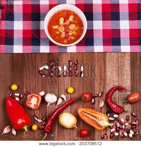 Tom Yum Goong Spicy Sour Soup on wooden table top view Thai local food