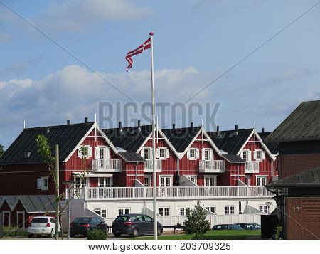 Wooden Houses And Danish Flag
