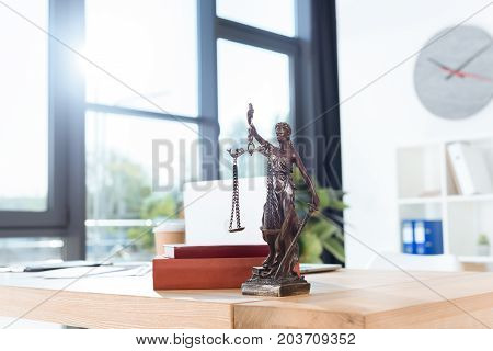 Lawyer Workplace With Themis Sculpture