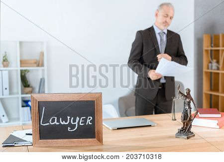 Lawyer Workplace With Themis Statue