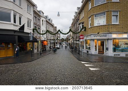 MAASTRICHT NETHERLANDS - JANUARY 09 2015: The narrow shopping streets in the historic center. Maastricht is the oldest city of the Netherlands and the capital city of the province of Limburg.