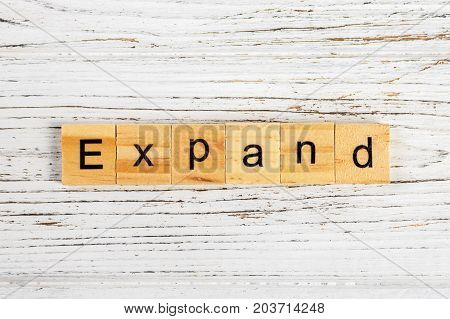 EXPAND word made with wooden blocks concept