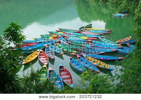 Traditional Nepalese Boats At The Docks At Fewa Lake, Pokhara City, Nepal