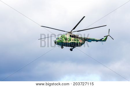 Samara Russia - September 10 2017: Russian Air Force Mi-8 helicopter in camouflage flying against cloudy sky