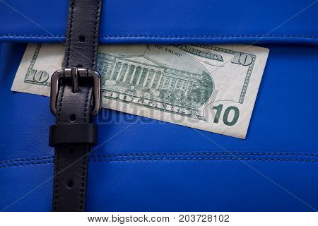 blue leather bag stitching with black buckle and dollar