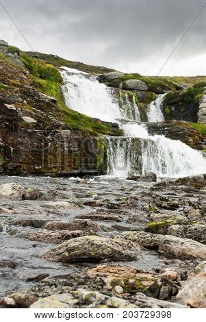 Waterfall in the mountains along the National tourist route Aurlandstjellet. Flotane. Western Norway