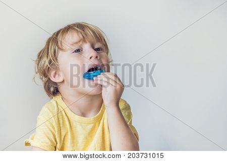 Three-year Old Boy Shows Myofunctional Trainer To Illuminate Mouth Breathing Habit. Helps Equalize T