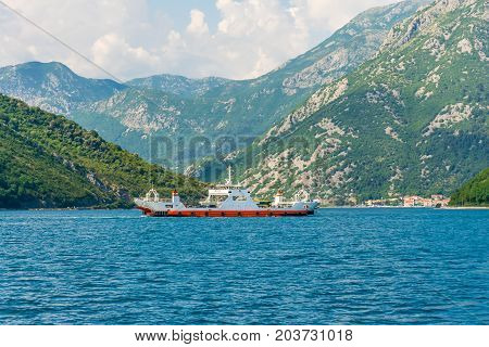 Montenegro, Kamenari And Lepetane - June 04/2017: Sea Ferries Carry Cars And Buses With Tourists Bet