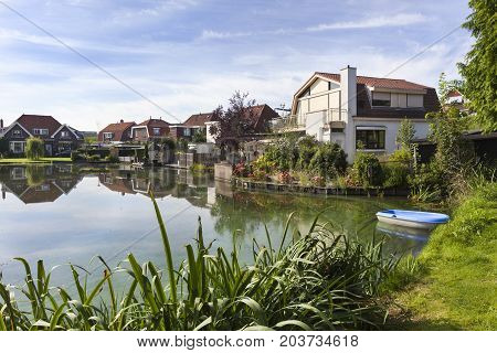 Traditional houses around a pond in Krimpen aan den IJssel in the Netherlands