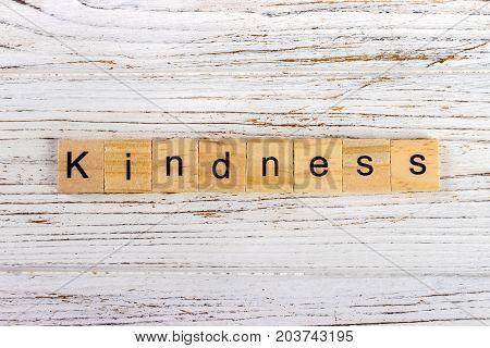 Kindness word made with wooden blocks concept