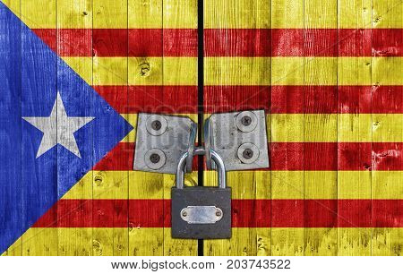 Catalonia flag on door with padlock close