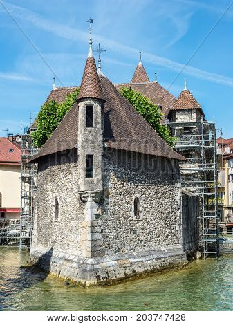 Annecy France - May 25 2016: The picturesque medieval prison in the old French resort town of Annecy. Today it is a museum. The building looks great in the middle of a large city canal (Thiou river).