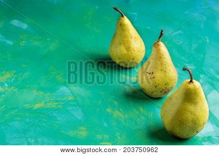 Fresh Pear fruit on a collorfull background. Concept of healthy eating .
