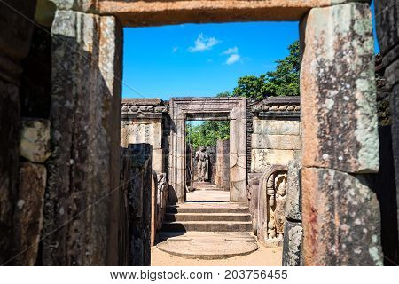 Statue of standing Buddha in Hatadage in Polonnaruwa ruins. Unesco world heritage on Sri Lanka.