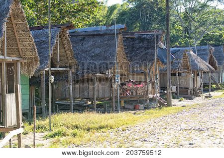June 6 2017 Misahualli Ecuador: row of small habitation shacks made of wood planks in the Amazon area