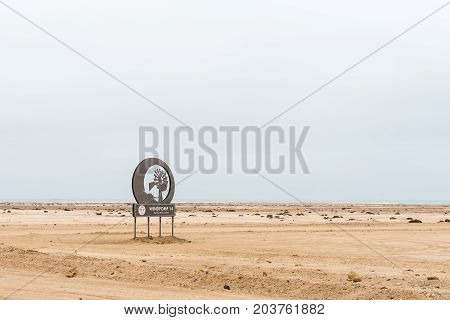 SWAKOPMUND NAMIBIA - JUNE 29 2017: Name board of Windpomp 14 (windmill 14) a camping site and restaurant in the Namib Desert to the North of Swakopmund on the Skeleton Coast of Namibia