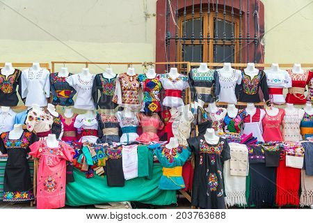 OAXACA MEXICO - MARCH 4: Outdoor stand with dresses and blouses for sale in Oaxaca Mexico on March 4 2017