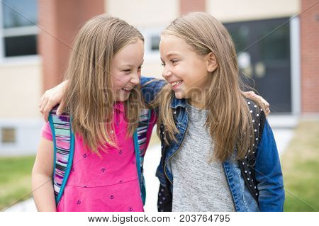 The Great Portrait Of School Pupil Outside Classroom Carrying Bags