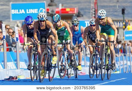 STOCKHOLM - AUG 26 2017: Group of fighting female triathlete cyclists Hewitt Sanders Gentle and competitors in the Women's ITU World Triathlon series event August 26 2017 in Stockholm Sweden