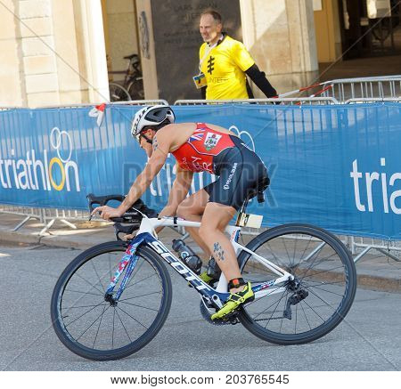 STOCKHOLM - AUG 26 2017: Leading female triathlete cyclist Flora Duffy in a curve in the Women's ITU World Triathlon series event August 26 2017 in Stockholm Sweden