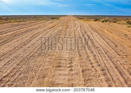Old sandy road in the Kyzylkum Desert in Kazakhstan.