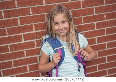 A nine years old girl student at school