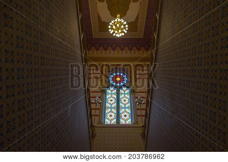 SARAJEVO BOSNIA AND HERZEGOVINA - APRIL 16 2017: Interior of the main hall of the Vijecnica the former library and city hall of Sarajevo destroyed during the 1991-1995 conflict and reconstruted characterized by its ottoman style