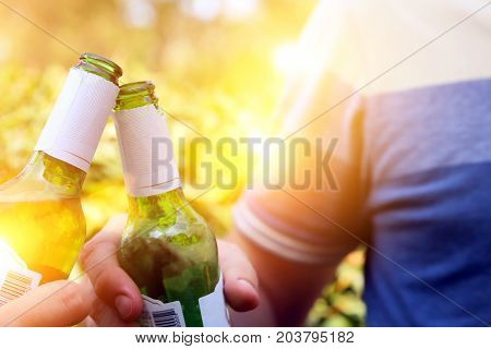 Friends toasting with beer. Picnic, party, nature, ourside