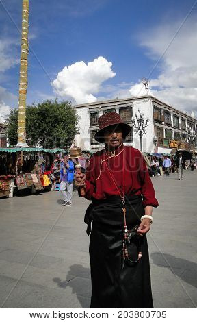 People Walk Around Jokhang Temple In Tibet