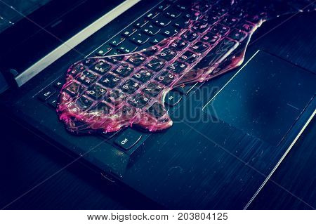 The red slime spread on the computer keyboard. Tools for quick cleaning of dust in hard to reach places