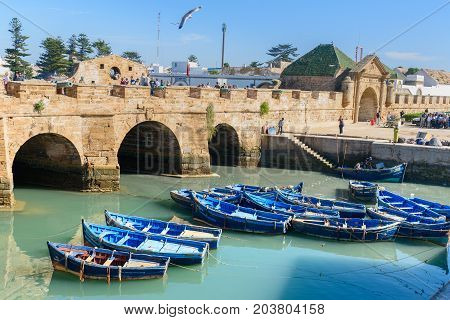 Fortress And Blue Fishing Boats In Essaouira. Morocco