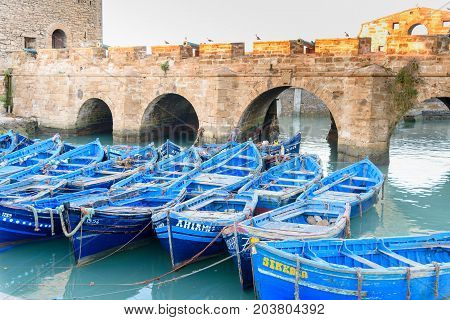 Fortress And Blue Fishing Boats In Essaouira. Morocco