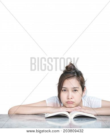 Closeup asian woman with boring face with a book on marble table in front of house isolated on white background with copy space