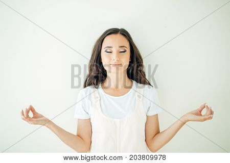 Female Holding Hands In Namaste Or Prayer, Eyes Closed While Practising Yoga
