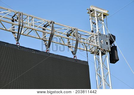 Baluster of a large LED screen outdoors against sky