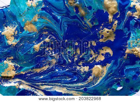 Marbled abstract background. Liquid marble pattern. Colorful marble backdrop. Golden glitter texture