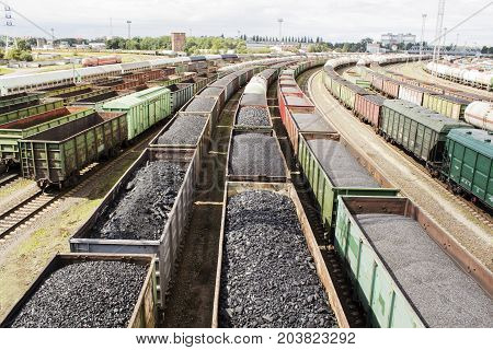 rail cars loaded with coal, a train transports coal. Many different rail cars
