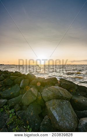 Sunset above a binary lake in the Netherlands with views over the water and the setting sun