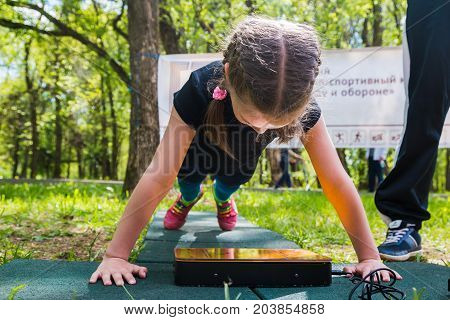 The Athlete Does Exercises During A Public Open Competition For Doing Standards Trp In Kirov City In