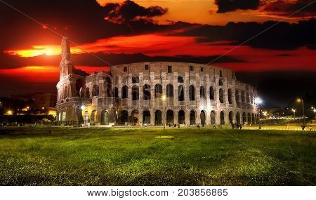 Ruins of great colosseum at the sunset