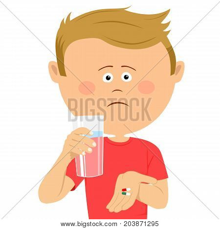 Unhappy little boy with glass of water shows two pils over white background